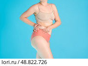 Tummy tuck, flabby skin on a fat belly, plastic surgery concept. Стоковое фото, фотограф Станислав Тарко / Фотобанк Лори