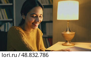 Beautiful, attractive, middle-aged woman in yellow sweater and a shining smile confidently looks at the camera, 4k, active lifestyle. Business concept, thinking about something, passionate about hobby. Стоковое AI-видео, аниматор ALLA YURTAYEVA / Фотобанк Лори