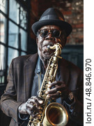 A close-up shot of a man in a hat playing a saxophone. He is wearing sunglasses and a jacket. Стоковое AI-изображение, AI-художник Данила Большаков / Фотобанк Лори