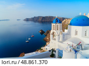 white belfries Santorini island, Greece. Стоковое фото, фотограф Anastasy Yarmolovich / Фотобанк Лори