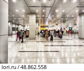 Phu Quoc, Vietnam - April 05, 2025: Travelers navigate through Phu Quoc Island Airport in Vietnam during a busy arrival period. Редакционное фото, фотограф Кривошеина Елена Леонидовна / Фотобанк Лори