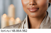 Close-up of lips with soft lighting highlighting natural beauty. Крупный план губ при мягком освещении, подчеркивающем естественную красоту. Стоковое AI-изображение, AI-художник Katsiaryna Repich / Фотобанк Лори