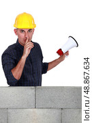 Worker with megaphone pleading silence. Стоковое фото, агентство Ingram Publishing / Фотобанк Лори