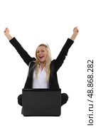 Triumphant businesswoman sitting at a laptop. Стоковое фото, агентство Ingram Publishing / Фотобанк Лори