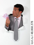 Businessman surprised at his windfall. Стоковое фото, агентство Ingram Publishing / Фотобанк Лори