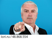 A boss blaming one of his employee. Стоковое фото, агентство Ingram Publishing / Фотобанк Лори