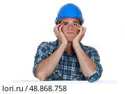 Head and shoulders of a young construction worker. Стоковое фото, агентство Ingram Publishing / Фотобанк Лори
