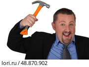 Businessman with a hammer. Стоковое фото, агентство Ingram Publishing / Фотобанк Лори