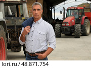 Farmer with tractors. Стоковое фото, агентство Ingram Publishing / Фотобанк Лори