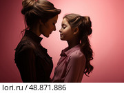 Harmony Unveiled: woman and young girl share a heartfelt moment as they stand side by side, showcasing the special connection between different age groups. Стоковое AI-изображение, AI-художник Данила Большаков / Фотобанк Лори