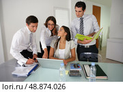 Business group preparing a proposal. Стоковое фото, агентство Ingram Publishing / Фотобанк Лори