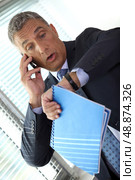 Businessman realizing he is late. Стоковое фото, агентство Ingram Publishing / Фотобанк Лори