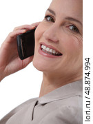 Woman stuck to the phone. Стоковое фото, агентство Ingram Publishing / Фотобанк Лори