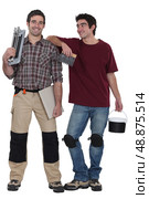 Two male handymen  stood together. Стоковое фото, агентство Ingram Publishing / Фотобанк Лори