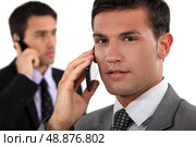 Businessmen talking on their mobile phones. Стоковое фото, агентство Ingram Publishing / Фотобанк Лори