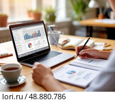 A man businessman while working in the company's office. Work with Laptop and documents. Стоковое AI-изображение, AI-художник Сергей Елизарьев / Фотобанк Лори