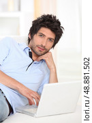 Man relaxing on the sofa. Стоковое фото, агентство Ingram Publishing / Фотобанк Лори