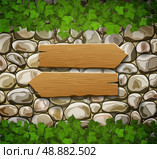 Stone wall with two wooden arrows and leaves. Стоковая иллюстрация, агентство Ingram Publishing / Фотобанк Лори