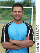 Football player stood on pitch. Стоковое фото, агентство Ingram Publishing / Фотобанк Лори