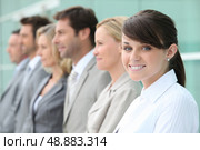 Line up of employees with the youngest in focus. Стоковое фото, агентство Ingram Publishing / Фотобанк Лори