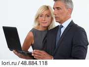 mature business couple posing. Стоковое фото, агентство Ingram Publishing / Фотобанк Лори
