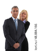 Blonde woman behind  man in a suit. Стоковое фото, агентство Ingram Publishing / Фотобанк Лори