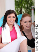 two girlfriends lying after fitness. Стоковое фото, агентство Ingram Publishing / Фотобанк Лори
