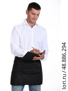 Male waiter taking order. Стоковое фото, агентство Ingram Publishing / Фотобанк Лори