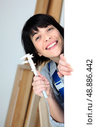 Woman holding calipers. Стоковое фото, агентство Ingram Publishing / Фотобанк Лори