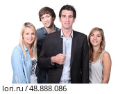 Adult and teenagers smiling. Стоковое фото, агентство Ingram Publishing / Фотобанк Лори