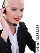 Fair-skinned woman wearing a headset. Стоковое фото, агентство Ingram Publishing / Фотобанк Лори