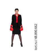 A businesswoman with boxing gloves on. Стоковое фото, агентство Ingram Publishing / Фотобанк Лори