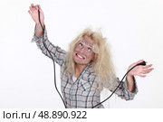 Woman getting an electric shock. Стоковое фото, агентство Ingram Publishing / Фотобанк Лори