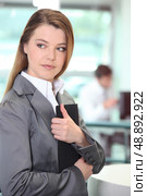Businesswoman clutching important document. Стоковое фото, агентство Ingram Publishing / Фотобанк Лори