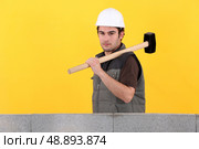 Construction worker holding a mallet. Стоковое фото, агентство Ingram Publishing / Фотобанк Лори