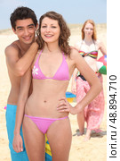 Teenagers larking about on the beach. Стоковое фото, агентство Ingram Publishing / Фотобанк Лори