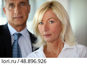 A secretary posing with her boss. Стоковое фото, агентство Ingram Publishing / Фотобанк Лори