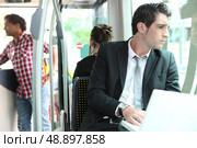 Businessman on the bus. Стоковое фото, агентство Ingram Publishing / Фотобанк Лори