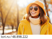 Sunshine and Shades: Vibrant Woman Blooms in Her Yellow Coat, confident woman stands tall, wearing sunglasses and striking yellow coat, radiating effortless style and charm. Стоковое AI-изображение, AI-художник Данила Большаков / Фотобанк Лори