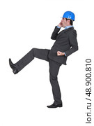 Man with helmet walking strangely. Стоковое фото, агентство Ingram Publishing / Фотобанк Лори