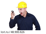 An architect yelling at his phone. Стоковое фото, агентство Ingram Publishing / Фотобанк Лори