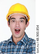 portrait of junior tradesman open-mouthed in surprise. Стоковое фото, агентство Ingram Publishing / Фотобанк Лори