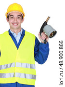 Worker holding blow torch. Стоковое фото, агентство Ingram Publishing / Фотобанк Лори