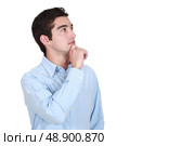 A pensive young man. Стоковое фото, агентство Ingram Publishing / Фотобанк Лори
