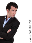 Businessman with his arms folded in disbelief. Стоковое фото, агентство Ingram Publishing / Фотобанк Лори