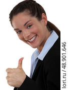 Excited woman giving the thumb’s up. Стоковое фото, агентство Ingram Publishing / Фотобанк Лори