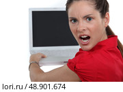 Woman angry with her laptop. Стоковое фото, агентство Ingram Publishing / Фотобанк Лори