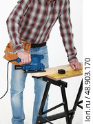 carpenter at work with sander machine. Стоковое фото, агентство Ingram Publishing / Фотобанк Лори