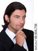 Pensive man dressed in suit. Стоковое фото, агентство Ingram Publishing / Фотобанк Лори
