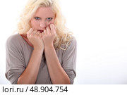 Nervous blond woman. Стоковое фото, агентство Ingram Publishing / Фотобанк Лори